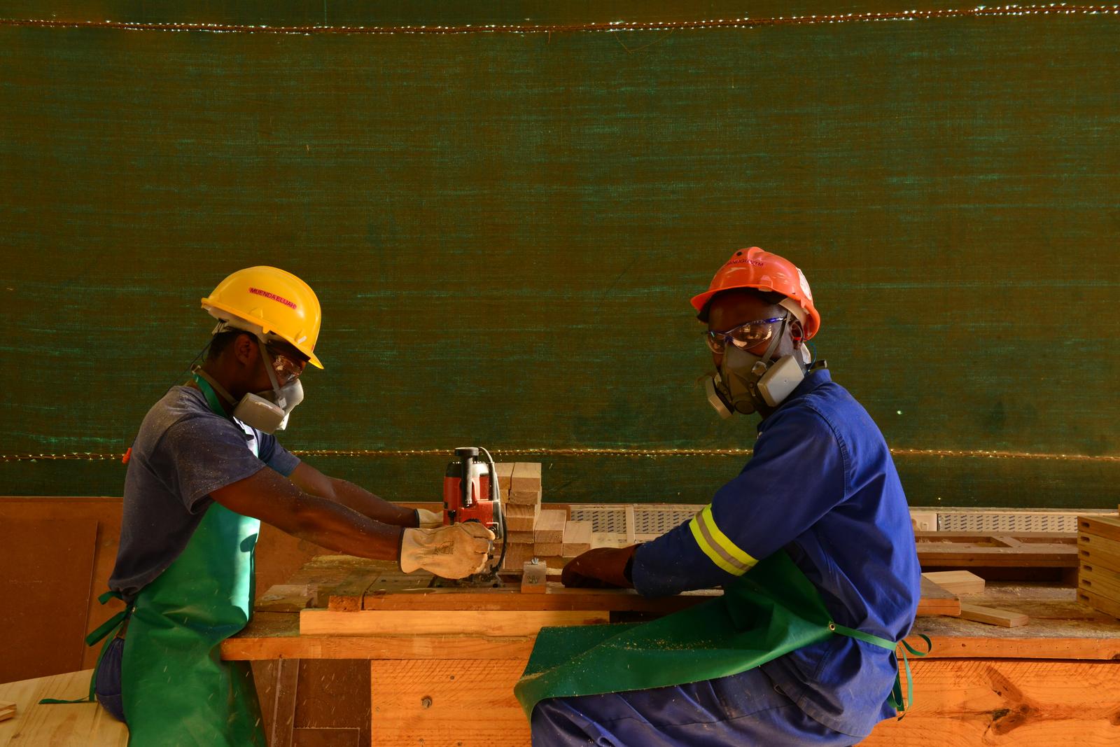 Workers cutting timber